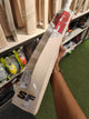 SF SS 27 English Willow Cricket Bat held in hand, showcasing its design and craftsmanship.